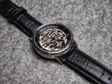 Classic men's watch on black leather strap