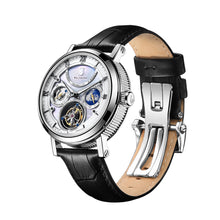 Silver tourbillon watch on a black leather strap