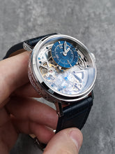 Skeleton watch with blue leather strap