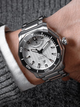 Silver dive watch wristshot
