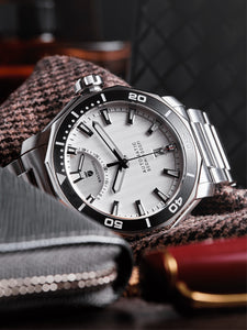 Silver dive watch with power reserve hand