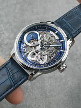 Blue skeleton watch with damascus steel dial