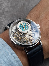 Skeleton watch with turquoise dial